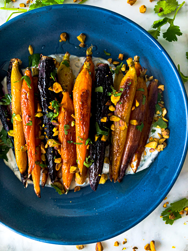 roasted carrots on cumin cilantro yogurt sauce