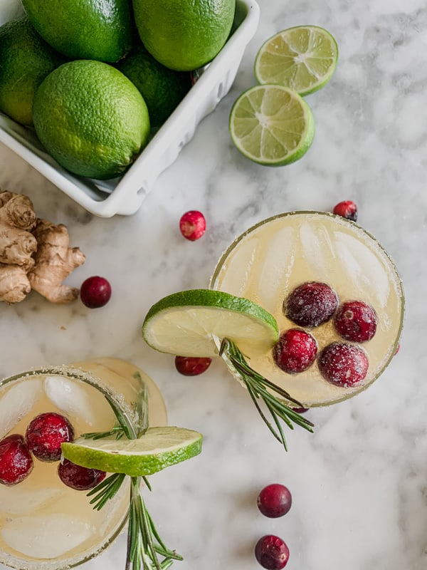 Christmas margarita with sugared cranberries, rosemary, and ginger